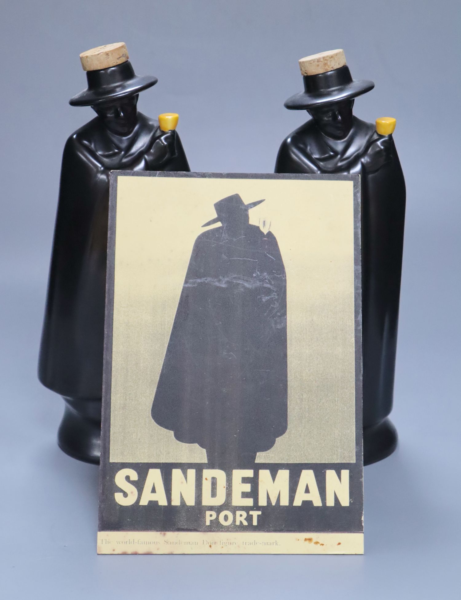 A pair of Doulton figural Sandeman port flasks (empty)